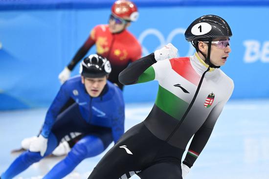 Liu Shaoang of Hungary completes the men's 500m short track speed skating semifinal at Capital Indoor Stadium in Beijing, capital of China, Feb. 13, 2022. (Photo/Xinhua)

