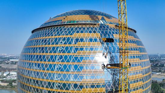 Glass facades of World's largest spherical building installed