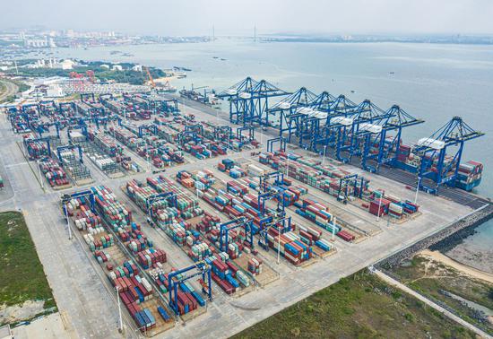 This aerial photo taken on Dec. 10, 2022 shows a view of the Yangpu international container terminal in the Yangpu Economic Development Zone, south China's Hainan Province. (Xinhua/Pu Xiaoxu)