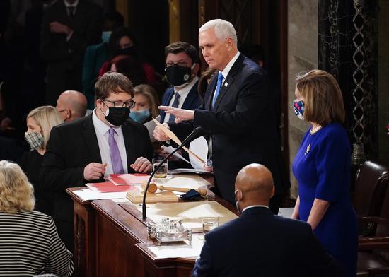 Former U.S. Vice President Mike Pence (C) take part in a joint session of the Congress to certify the 2020 election results at the U.S. Capitol in Washington, D.C., the United States, Jan. 6, 2021. (Kevin Dietsch/Pool via Xinhua)