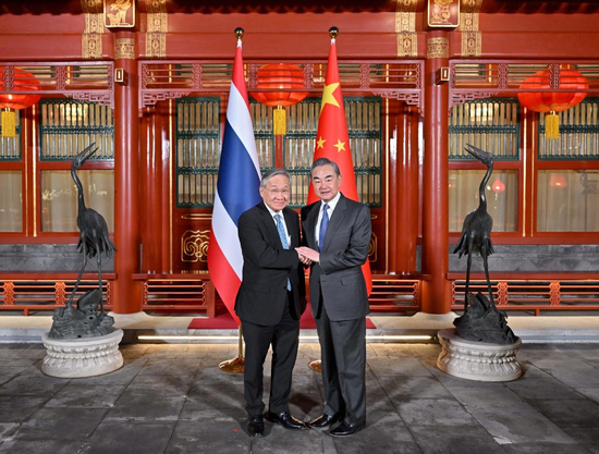 Wang Yi, a member of the Political Bureau of the Communist Party of China (CPC) Central Committee and director of the Office of the Foreign Affairs Commission of the CPC Central Committee, meets with Thai Deputy Prime Minister and Foreign Minister Don Pramudwinai in Beijing, capital of China, Feb. 13, 2023. (Xinhua/Yue Yuewei)