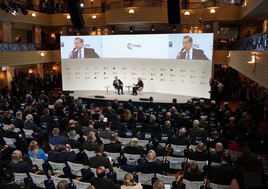 Wang Yi, a member of the Political Bureau of the Communist Party of China (CPC) Central Committee and director of the Office of the Foreign Affairs Commission of the CPC Central Committee, answers questions at the Munich Security Conference in Munich, Germany, on Feb. 18, 2023. (Xinhua/Jin Mamengni)