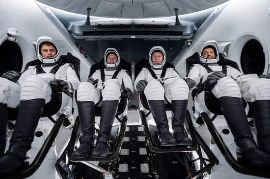 The crew members of the SpaceX Crew-6 mission, Roscosmos cosmonaut Andrey Fedyaev (L1), NASA astronaut Warren 