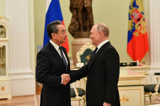 Russian President Vladimir Putin meets with Wang Yi, a member of the Political Bureau of the Communist Party of China (CPC) Central Committee and director of the Office of the Foreign Affairs Commission of the CPC Central Committee, in Moscow, Russia, Feb. 22, 2023. (Xinhua/Cao Yang)