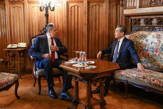 Wang Yi, a member of the Political Bureau of the Communist Party of China (CPC) Central Committee and director of the Office of the Foreign Affairs Commission of the CPC Central Committee, meets with Russian Foreign Minister Sergei Lavrov in Moscow, Russia, Feb. 22, 2023. (Russian Foreign Ministry/Handout via Xinhua)