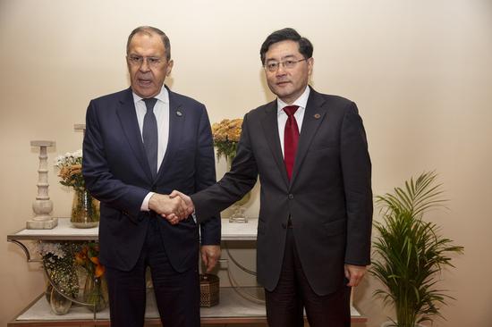 Chinese Foreign Minister Qin Gang (R) meets with his Russian counterpart Sergei Lavrov on the sidelines of the Group of 20 (G20) Foreign Ministers' Meeting in New Delhi, India, March 2, 2023. (Photo by Javed Dar/Xinhua)