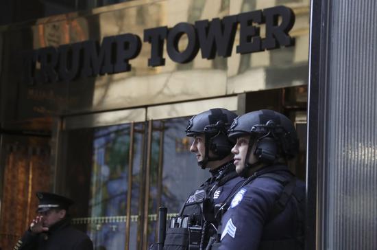 Police officers stand guard at the entrance of Trump Tower in New York, the United States, on Jan. 19, 2017.  (Xinhua/Wang Ying)

