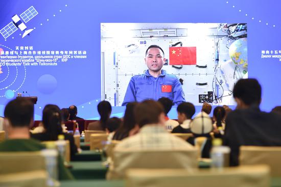 China's Shenzhou-15 astronauts talk with youths from SCO