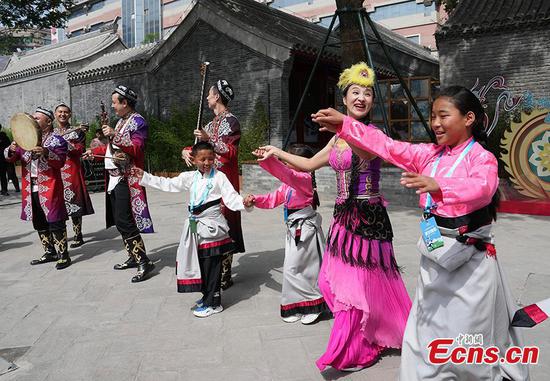 Children from Tibetan Autonomous Prefecture of Yushu, northwest China's Qinghai Province, learn how to perform at an ethnic museum in Beijing, June 1, 2023. (Photo: China News Service/ Cui Nan)