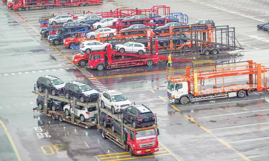 Transport trucks move cars inside a depot at Nansha Automobile Port in Guangzhou, South China's Guangdong Province on April 19, 2023. (Photo: Chen Tao/GT)