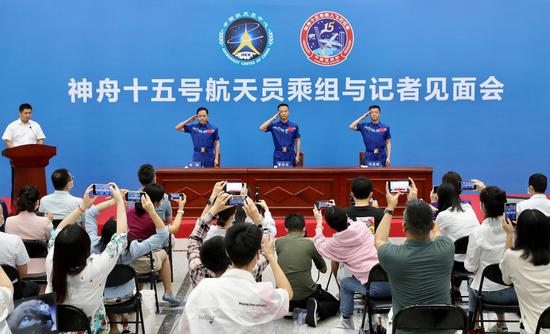 The three astronauts of Shenzhou XV mission, Zhang Lu (left), Fei Junlong (center), and Deng Qingming, meet with press in Beijing, July 31, 2023. (Photo by Xu Bu/for chinadaily.com.cn)