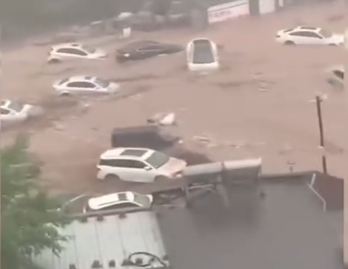 Heavy downpours hit Beijing, 2 dead   