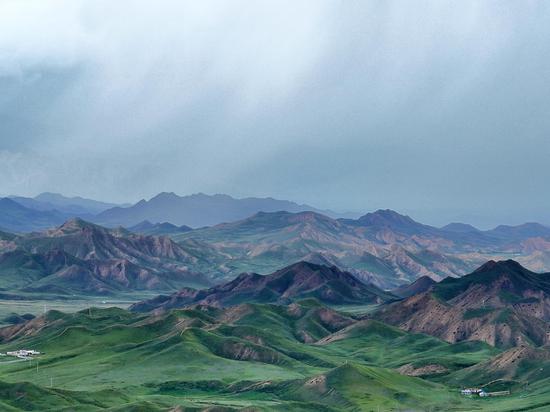 Stunning view of stretching mountain ranges on NW China grassland