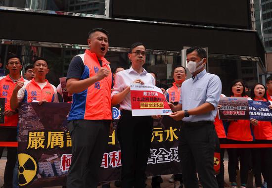 Members of Democratic Alliance for the Betterment and Progress of Hong Kong, hold a protest outside the Consulate-General of Japan in Hong Kong on Aug 23, 2023 in response to Japan's decision to release wastewater from its Fukushima nuclear plant into the Pacific Ocean from Aug 24, 2023. (Calvin Ng/China Daily)