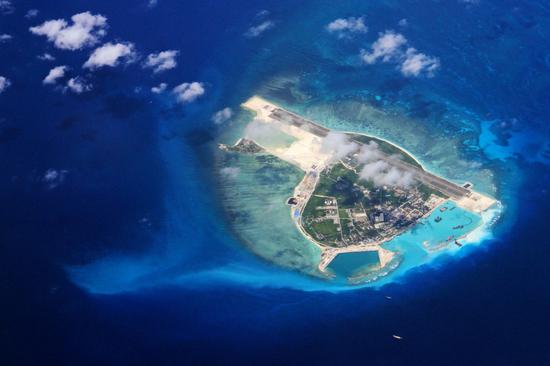 PLA warns off U.S. warship near Xisha Islands