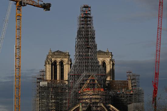 Notre Dame spire rises from ashes after 2019 fire in Paris