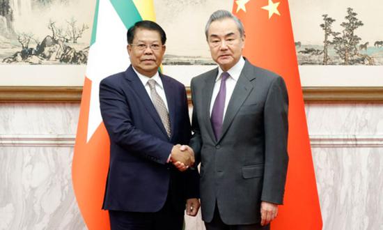 Chinese Foreign Minister Wang Yi (right) meets with Myanmar’s Deputy Prime Minister and Union Minister for Foreign Affairs U Than Swe on Wednesday. (Photo/fmprc.gov.cn)