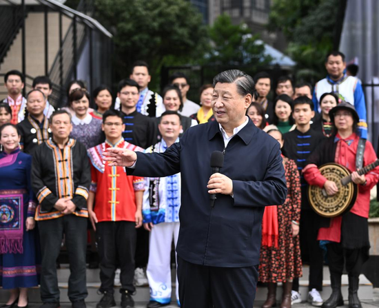 Xi Jinping, general secretary of the Communist Party of China Central Committee, communicates with residents while inspecting the Panlong community in Liangqing district, Nanning, capital of South China's Guangxi Zhuang autonomous region, Dec 14, 2023. [Photo/Xinhua