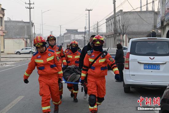Rescuers transfer the injured to the hospital at Dahejian township, Jishishan County of Linxia Hui Autonomous Prefecture, northwest China's Gansu Province, Dec. 18, 2023. 