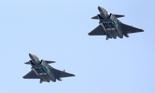 Two J-20s howling through the sky with their missile bays open, each showcasing six missiles as the stealth fighter jets celebrated the 69th birthday of the Chinese People's Liberation Army Air Force on the last day of the Airshow China 2018 in Zhuhai, Guangdong Province on Sunday. (Photo: Cui Meng/GT)