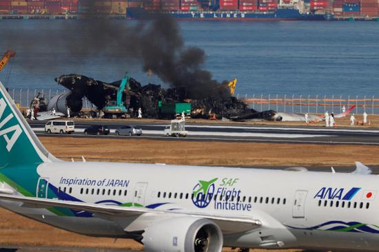 Wreckage clean-up starts at Tokyo airport