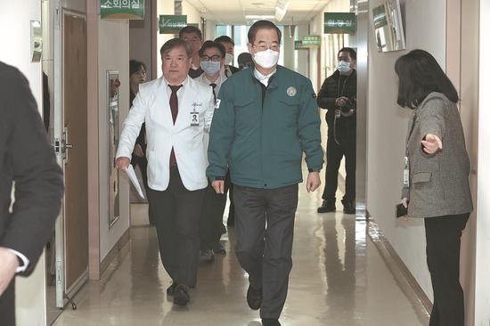 S. Korean hospitals under strain as doctors' strike widens