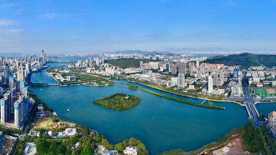 An aerial panoramic drone photo taken on Jan. 24, 2024 shows a view of Yundang Lake and its surroundings in Xiamen, southeast China's Fujian Province. (Xinhua/Jiang Kehong)