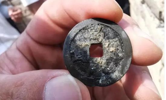 Ming Dynasty copper coin unearthed at Great Wall for first time