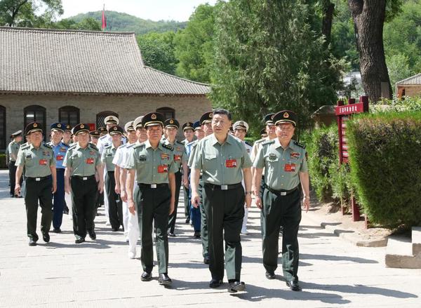 Chinese President Xi Jinping, also general secretary of the Communist Party of China Central Committee and chairman of the Central Military Commission (CMC), leads CMC members and heads of various departments and units to visit the revolutionary relics at Wangjiaping in Yan'an, northwest China's Shaanxi Province, June 17, 2024. The CMC Political Work Conference was held from Monday to Wednesday in Yan'an, an old revolutionary base in northwest China's Shaanxi Province. Xi attended the conference and delivered an important speech. (Xinhua/Li Gang)