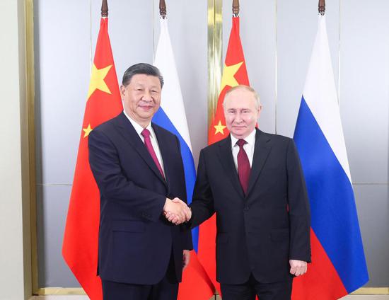 Chinese President Xi Jinping meets with Russian President Vladimir Putin ahead of the 24th Meeting of the Council of Heads of State of the Shanghai Cooperation Organization in Astana, Kazakhstan, July 3, 2024. (Xinhua/Ju Peng)