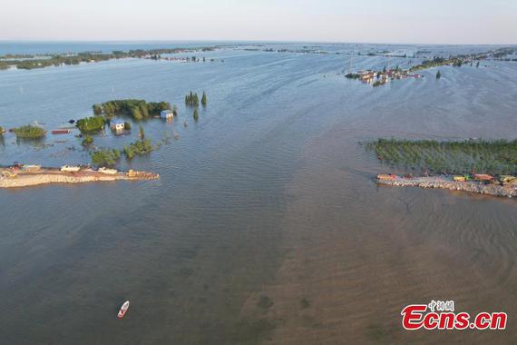 Drone photo shows the dike breach of Dongting Lake in Huarong County, Yueyang City of Hunan Province on July 7, 2024. (Drone photo: China News Service/Yang Huafeng)