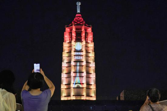 Paris 2024 | Heritage site lit up for team China