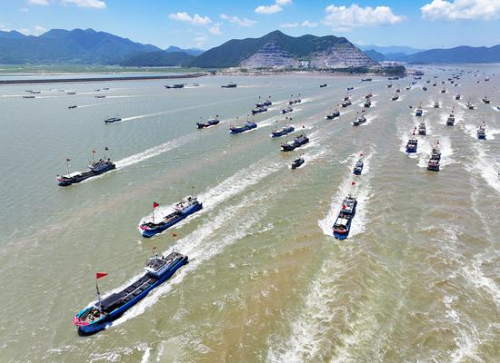 Fishing boats set sail as summer ban ends on east China sea