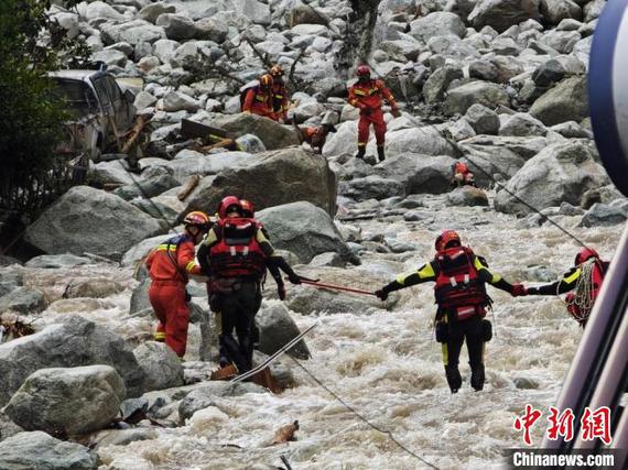 Rescuers search at the