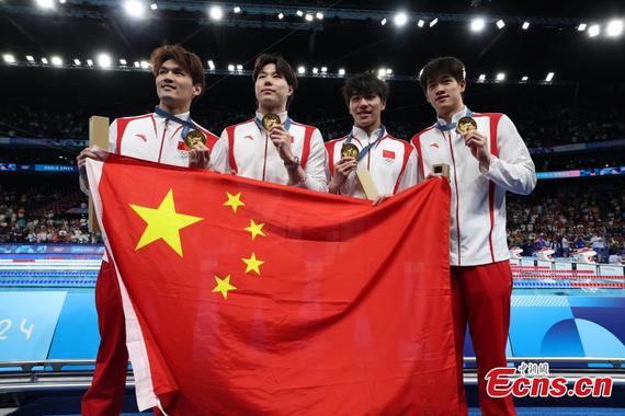 Gold medalists Team China attend the awarding ceremony for the men's 4 x 100m medley relay of swimming at Paris 2024 Olympic Games, France, Aug. 4, 2024. (Photo: China News Service/Fu Tian)