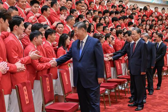 Xi hails Olympians for winning glory for country