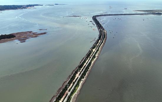 Road stretches on sea in Guangxi