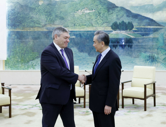 Foreign Minister Wang Yi meets with Russian Deputy Foreign Minister Andrey Rudenko in Beijing on Wednesday. (Photo/mfa.gov.cn)