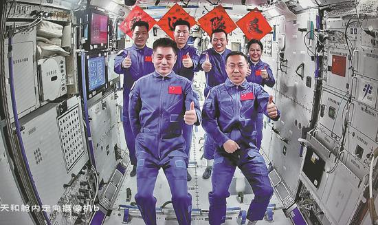 The crew of Shenzhou XVIII and Shenzhou XIX pose for a photo on Wednesday inside the Tiangong space station. (XU BU/FOR CHINA DAILY)