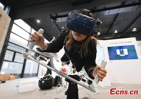 People visit an exhibition featuring cutting-edge technologies and productsat the 2024 World Internet Conference (WIC) Wuzhen Summit, east China's Zhejiang Province, Nov. 21, 2024. (Photo: China News Service/Wang Gang)