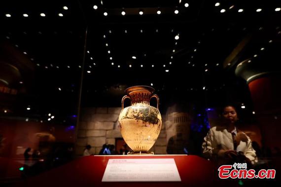 Visitors view ancient Greek artifact exhibited at the Capital Museum in Beijing, Nov. 20, 2024. (Photo: China News Service/Yi Haifei)