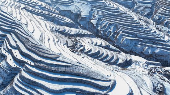 Terraced fields covered in snow resembles ‘fingerprints of Earth’