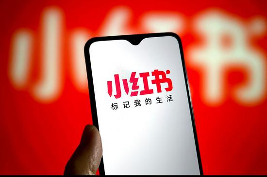 Xiaohongshu-linked stocks surge as app tops US download charts