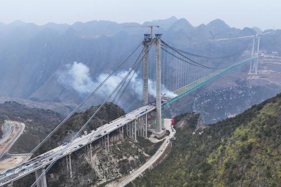 World's tallest bridge in Guizhou province one step closer to opening