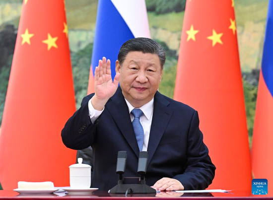 Xi talks with Putin via video meeting