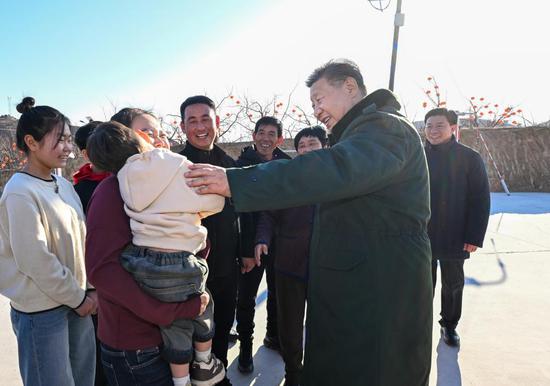 Xi sits down with family in flood-affected village ahead of Spring Festival