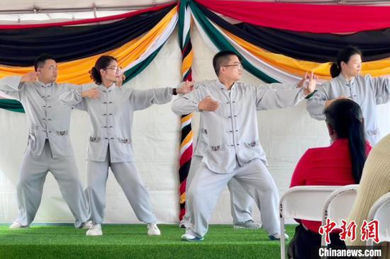 The 20th China (Jiangsu) medical aid team to Guyana showcase the traditional Chinese fitness exercise Baduanjin at the Mashramani festival celebration in Georgetown Feb. 21, 2025. (Photo: China News Network/Wang Lin)