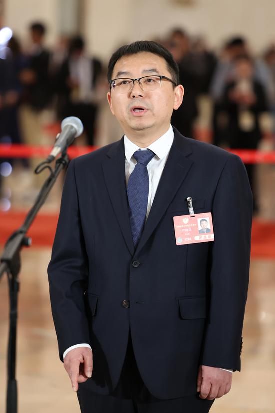 Yan Jianbing, a member of the 14th National Committee of the Chinese People's Political Consultative Conference, attends a group interview ahead of the opening meeting of the third session of the 14th CPPCC National Committee at the Great Hall of the People in Beijing, March 4, 2025. (Photo by Wang Jing/chinadaily.com.cn)
