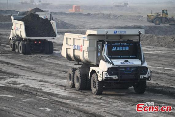 Unmanned mining trucks loaded with stripped soil and rock make their ways to the dumping site at the Yimin coal mine, HulunBuir, north China's Inner Mongolia autonomous region, May 15, 2025. (Photo: China News Service/Liu Wenhua) Unmanned mining trucks loaded with stripped soil and rock make their ways to the dumping site at the Yimin coal mine, HulunBuir, north China's Inner Mongolia autonomous region, May 15, 2025. (Photo: China News Service/Liu Wenhua)