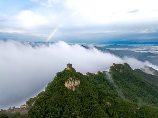 Rainbow appears in sky above Simatai Great Wall in Beijing after rainfall